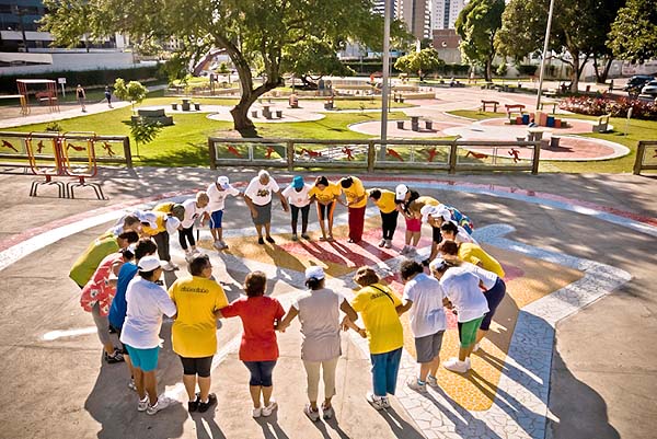 Photo of group at an outdoor gym forming a circle 